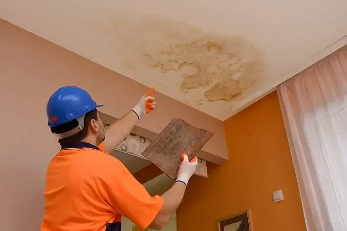 Miami Rapid Restoration Technician Inspecting Water Damage